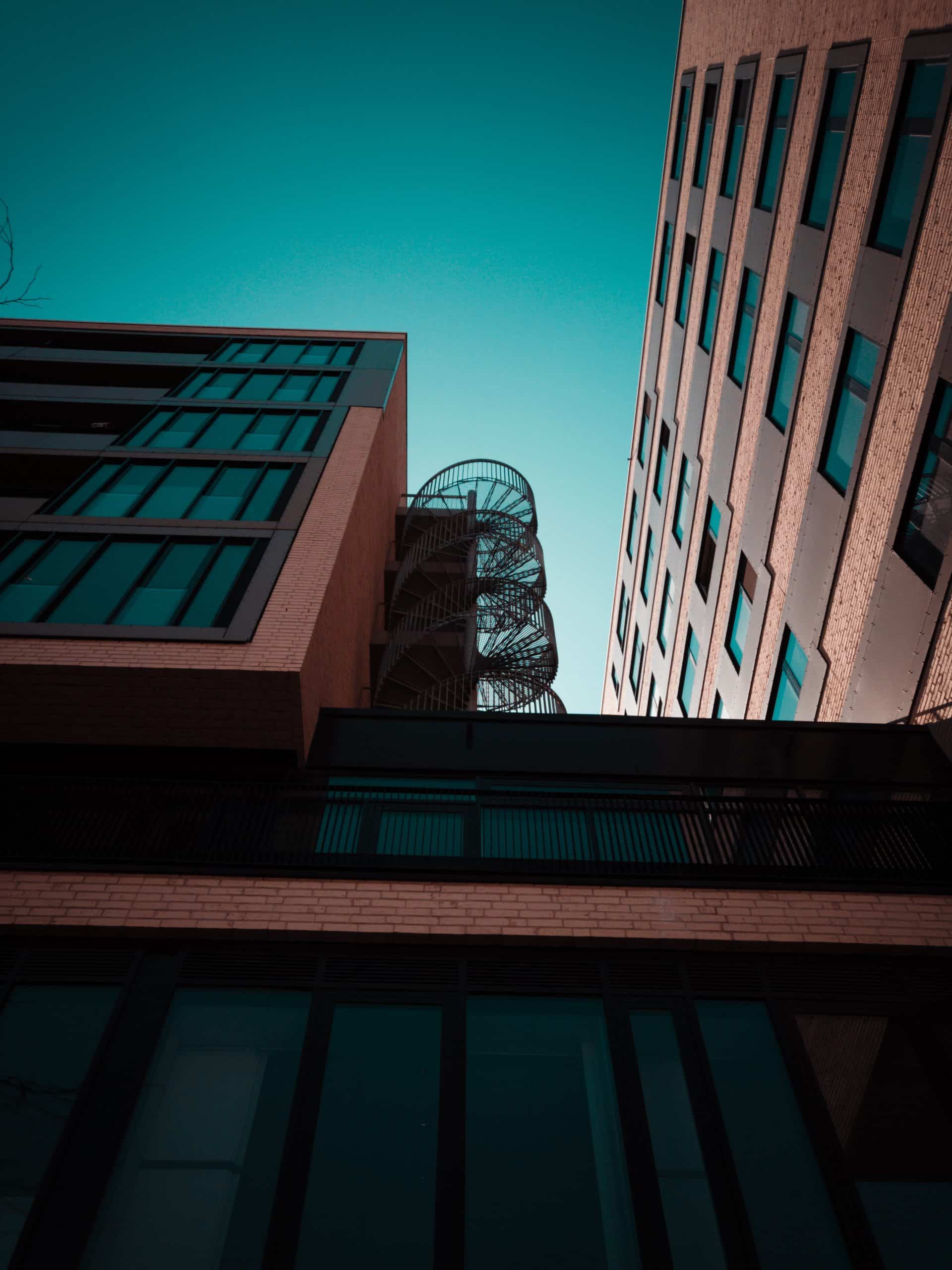 brown building exterior metallic staircase scaled